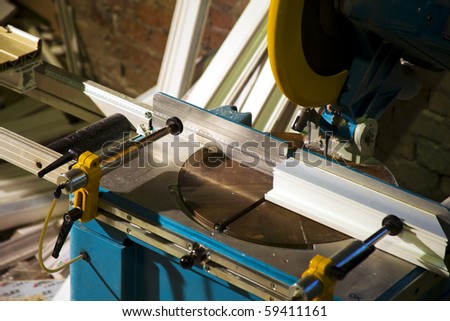 Saw machine  cut plastic - window manufacture