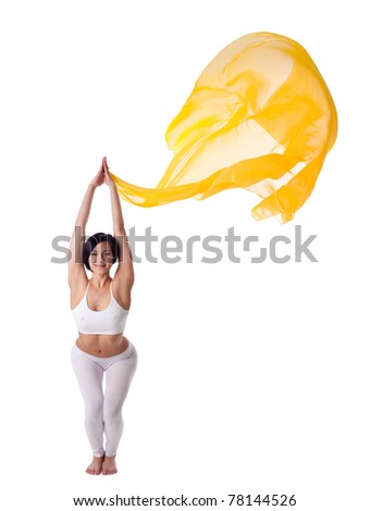 young woman doing yoga exercise and flying veil
