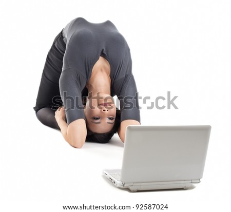 young business woman in yoga pose look at notebook