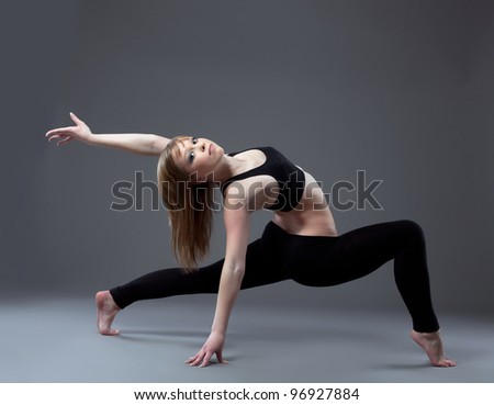 young high skill acrobat posing in dance