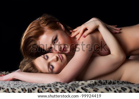 stock photo Two playful naked lesbian ladies look at camera