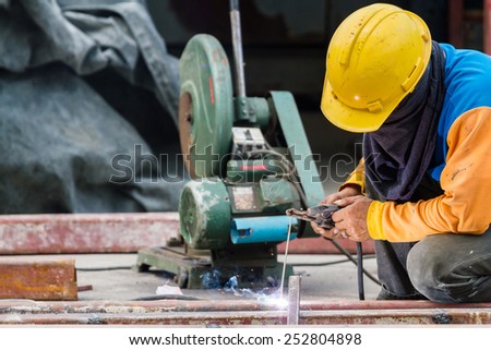 Steel Workers welding, grinding, cutting in metal industry