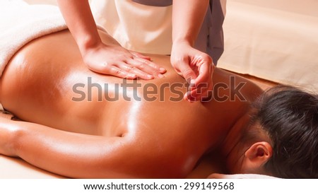 woman getting a massage at a health and beauty spa