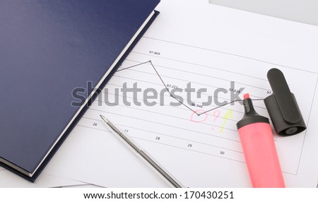 Business still-life of a graph, pen, marker, diary, question