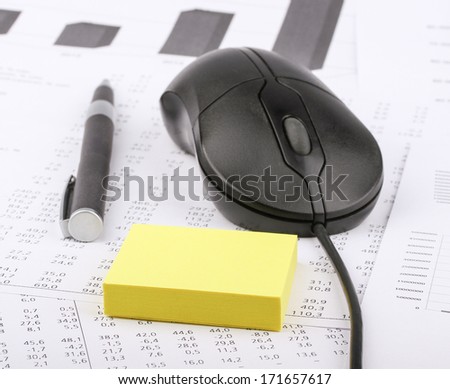 Business still-life of a pen, sticker, computer mouse