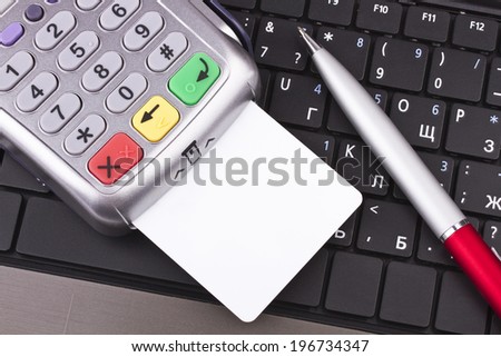 Business still-life of tables, payment terminal, credit Cards, notebook, pen
