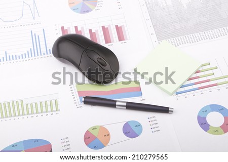 Business still-life of a black pen, computer mouse