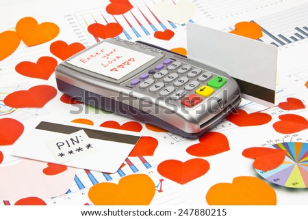 Business still-life of the payment terminal, credit cards, text message, many heart, LOVE-code