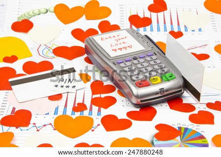 Business still-life of the payment terminal, credit cards, text message, many heart, LOVE-code