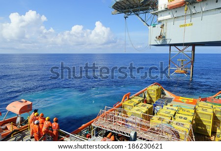 GOREK OILFIELD, MALAYSIA - APRIL 6, 2014: Search and rescue of a man overboard drill carried out between a Jack up platform and the offshore vessel in Gorek Oilfield, Malaysia in 2014.
