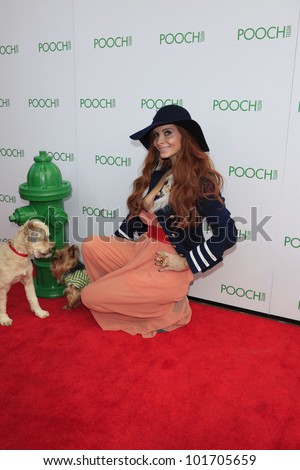 LOS ANGELES, CA - MAY 3: Phoebe Price, dog Henry at the grand opening of the Pooch Hotel on May 3, 2012 in Hollywood, Los Angeles, California. The Pooch Hotel is a luxury hotel for dogs.