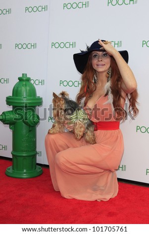 LOS ANGELES, CA - MAY 3: Phoebe Price, dog Henry at the grand opening of the Pooch Hotel on May 3, 2012 in Hollywood, Los Angeles, California. The Pooch Hotel is a luxury hotel for dogs.