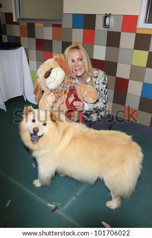 LOS ANGELES, CA - MAY 3: Joan Van Ark, dog Goldie at the grand opening of the Pooch Hotel on May 3, 2012 in Hollywood, Los Angeles, California. The Pooch Hotel is a luxury hotel for dogs.