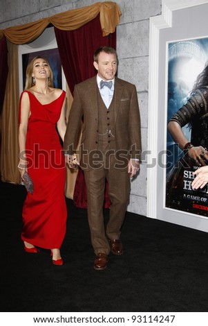 LOS ANGELES - DEC 6: Jacqui Ainsley; Guy Ritchie at the premiere of Warner Bros. ''Sherlock Holmes: A Game Of Shadows' at the Regency Village Theater on December 6, 2011 in Los Angeles, California