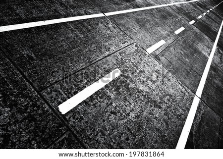 Asphalt two way bike lane details. Cross processed (black and white).
