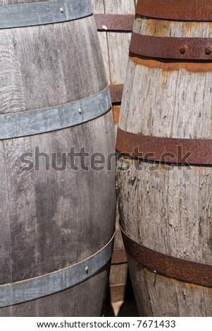 Closeup of two old wooden barrels with iron rings