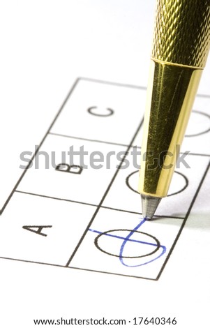 Choosing and marking by a cross with a golden ball-pen