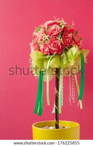 Decoration artificial flower and red wall