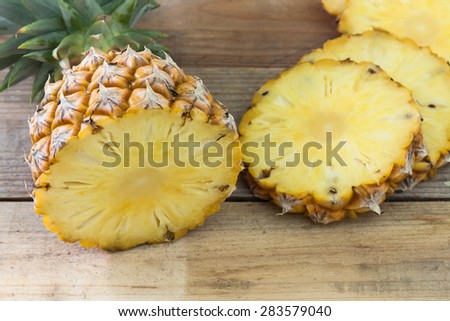 Pineapple slices on wood table