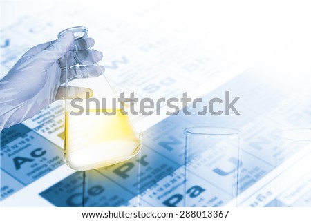 scientist  holding flask for chemical test in chemistry lab, test tube and periodic Table background