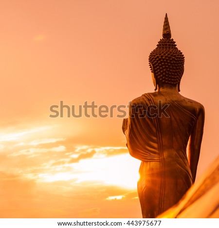 Golden Buddha statue standing on a mountain at  Wat Phra That Khao Noi, Nan Province, Thailand