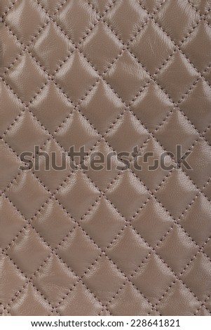 Beige quilted leather background