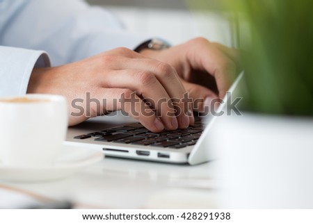 Close up view of businessman, designer or student hands working on laptop. Online distant education, writing blog, freelance, mobile payments, working at office or at home concept.