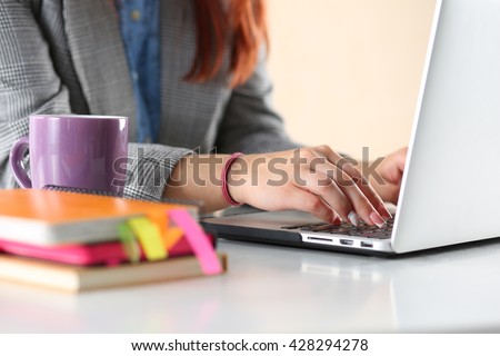 Close up view of businesswoman, designer or student hands working on laptop. Online distant education, writing blog, freelance, mobile payments, working at office or at home concept.