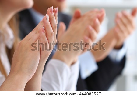 Close up view of business seminar listeners clapping hands. Professional education, business meeting, presentation or coaching concept