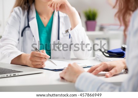 Doctor consulting patient hands closeup. Patient sitting at doctor office. Diagnostic, prevention of women diseases, healthcare, medical service, consultation or education, healthy lifestyle concept