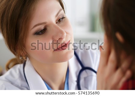 Female medicine doctor examining patient. Healthcare, medical service and insurance concept. Dermatologist or ENT examination.