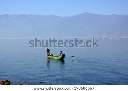 People fishing on Erhai lake near Dali, Yunnan province, China