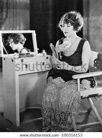 Woman at dressing table