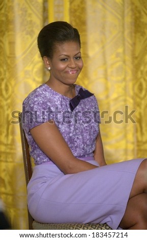Michelle Obama, in an Anne Klein New York dress, at a public appearance for Afternoon Tea Honoring Women in the Military, East Room of the White House, Washington DC, DC November 18, 2009