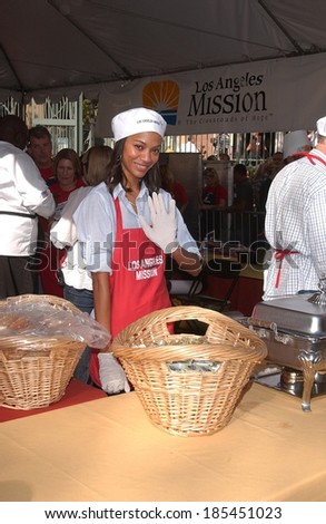Zoe Saldana at a public appearance for Los Angeles Mission Thanksgiving Meal for the Homeless, LA Mission Kitchen, Los Angeles, CA November 25, 2009
