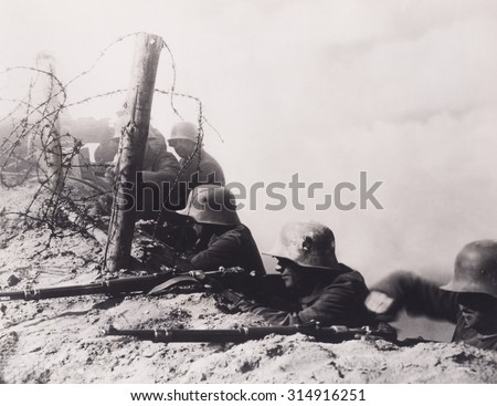World War One German soldiers firing from a trench