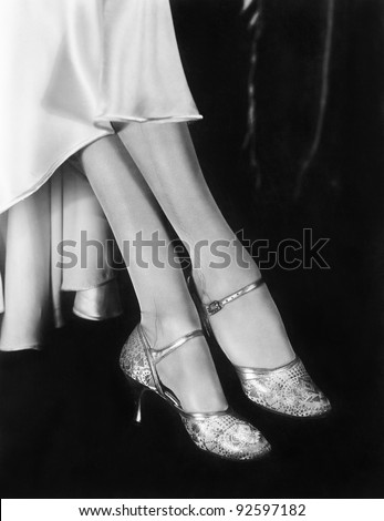 Low section view of a woman wearing high heels