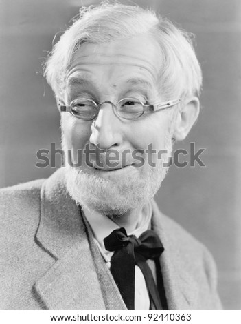 Man with beard and glasses making a silly face