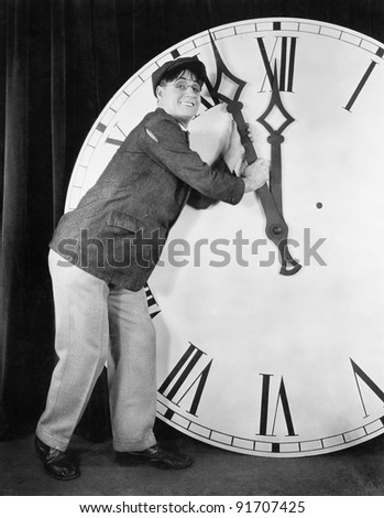 Man setting time on a big clock