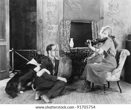 dog playing violin