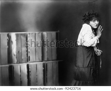 Young woman turning away and looking scared