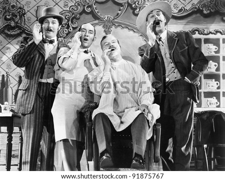 Four men at a barber shop singing Four men at a barber shop singing