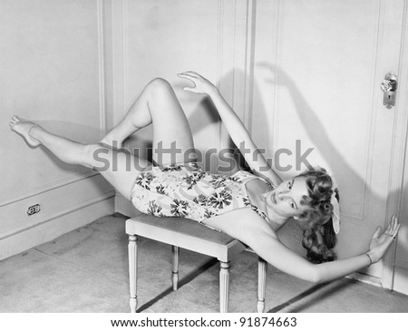 Woman exercising on chair