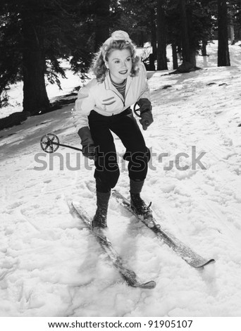 Woman on skis with knees bent