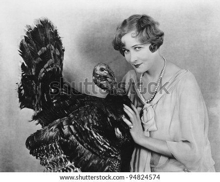 Portrait of woman with live turkey