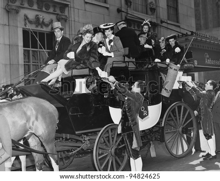 Wealthy group of people in horse drawn carriage