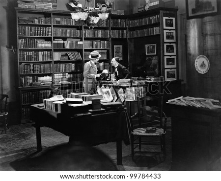 Customer and clerk in book shop
