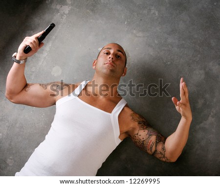 stock photo : Attractive Gangster Man with Gun and tattoos