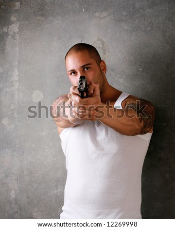 Attractive Gangster Man with Gun and tattoos