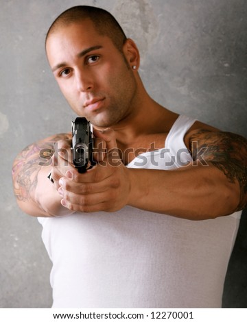 Attractive Gangster Man with Gun and tattoos